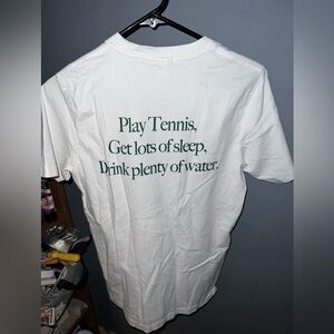 Sporty & Rich White Tee with Green Tennis Slogan